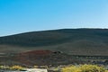 Hikers on top of the Inferno Cone at Craters of the Moon National Monument in Idaho, USA Royalty Free Stock Photo