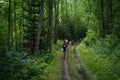 Hikers walk through the dense and lush foliage of Arrowhead park, Ontario, Canada