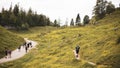 Hikers walking along a hiking trail to the forested canyon with narrow hillside,Kaiserklamm, Austria Royalty Free Stock Photo