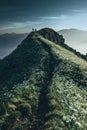 Hikers walking at sunrise on top of italian alps mountains Royalty Free Stock Photo