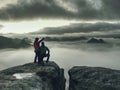 Hikers woman and man in sportswear on highest mountain