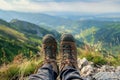 Hiking Adventure Panorama Close Up of Feet with Hiking Shoes from a Young Woman Resting on Top of a High Hill or Rock, Landscape