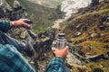 Hiking Adventure Tourism Vacation Holiday Concept. Unrecognizable Traveler Man Holding Thermos In His Hand And Enjoy View Of