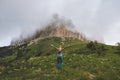 Hiking adventures in foggy mountains woman hiker raised hands travel solo extreme vacations Royalty Free Stock Photo