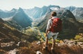 Hiking alone in Norway mountains Man with red backpack Royalty Free Stock Photo