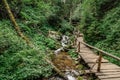 Hiking along Bila Opava River,Jeseniky Mountains,Czech Republic.Tourist trail with waterfalls,cascades,small wooden bridges and