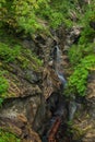 Hiking along a woodend boardwalk in a canyon near Kaprun, Austria Royalty Free Stock Photo