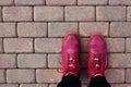 Hiking backpacking world tourism walking old pinky pink purple shoes boots on the asphalt feet Royalty Free Stock Photo