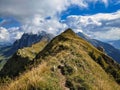 hiking in the beautiful swiss mountains. Lutispitz above Wildhaus in Toggenburg. View of the Santis Alpstein