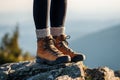 Hiking boot in mountains. Ankle boots with woolen socks