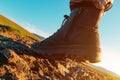 Hiking boot on rocky mountain terrain, man walking outdoor in nature Royalty Free Stock Photo