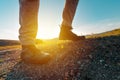 Hiking boot on rocky mountain terrain, man walking outdoor in nature Royalty Free Stock Photo