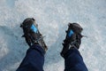 Hiking boots with crampon on Ice