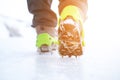 Hiking boots with equipment for ice. Snow like a background and sun. Sun is shining. Moutains and travel. Royalty Free Stock Photo