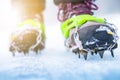 Hiking boots with equipment for ice. Snow like a background and sun. Sun is shining. Moutains and travel. Royalty Free Stock Photo