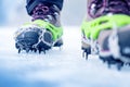 Hiking boots with equipment for ice. Snow like a background and sun. Sun is shining. Moutains and travel. Royalty Free Stock Photo