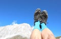 hiking boots of the hiker while resting with high legs and the m Royalty Free Stock Photo