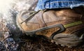 Hiking boots in outdoor action climbing on stone