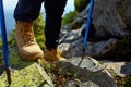 Hiking boots on the rock in the mountains. Royalty Free Stock Photo