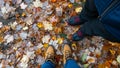 Hiking boots on top of colorful fall tree leaves Royalty Free Stock Photo