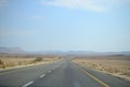 High road at bottom of Makhtesh Ramon Crater, Mitzpe Ramon, Negev desert, Israel Royalty Free Stock Photo