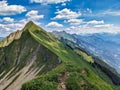 Hiking on the breathtaking Hardergrat in the Bernese Alps. Extremely dangerous path on the mountain ridge Royalty Free Stock Photo