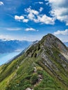 Hiking on the breathtaking Hardergrat in the Bernese Alps. Extremely dangerous path on the mountain ridge Royalty Free Stock Photo