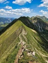 Hiking on the breathtaking Hardergrat in the Bernese Alps. Extremely dangerous path on the mountain ridge Royalty Free Stock Photo