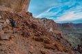 Hiking Canyonlands Backpacker on the trail to False Kiva