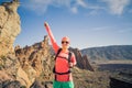 Climbing or hiking success with arms outstretched in mountains Royalty Free Stock Photo