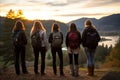 Hiking Companions Conquering Peaks, Friends Reaching New Heights at Majestic Mountain Sunset Royalty Free Stock Photo