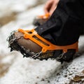 Close up of snow shoes and shoe spikes in winter. Royalty Free Stock Photo