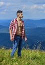 Hiking concept. Strong hiker muscular torso. Athlete muscular guy relax mountains. Power of nature. Man unbuttoned shirt