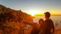 Hiking couple enjoying scenic sunrise from the Path of the Gods between Positano and Praiano on the Amalfi Coast, Campania, Italy Royalty Free Stock Photo