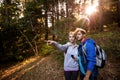 Hiking couple holding a compass and pointing Royalty Free Stock Photo