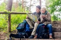 Hiking couple having break on forest trail Royalty Free Stock Photo