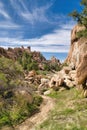 Hiking dirt road amidst giant rocks at Joshua Tree National Park California