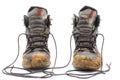 Hiking dirty boots on white background Royalty Free Stock Photo