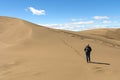 Hiking Down a Lonely Sand Dune