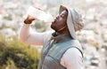 Hiking, drinking water and black man with fitness, health or hydration with workout, peace or exercise. African person Royalty Free Stock Photo