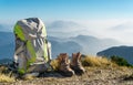 Hiking equipment. Backpack and boots on top of mountain. Royalty Free Stock Photo