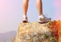 Hiking feet stand seaside rock Royalty Free Stock Photo