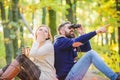 Hiking with friends. surprised girl drink mulled wine. camping and hiking. bearded man shocked watch with binoculars Royalty Free Stock Photo