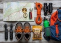 Hiking gear is laid out on a wooden surface. Items include a Royalty Free Stock Photo