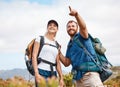 Hiking, happy and couple in nature, relax and smile, hand and pointing while talking and looking around. Friends, hikers