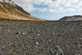 Hiking in Iceland, rugged valleys, black sediment Royalty Free Stock Photo