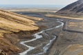 Hiking in Iceland, rugged valleys, black sediment Royalty Free Stock Photo