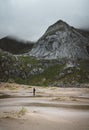 Hiking impressions at Bunes sand beach with view to Bunes Fjorden at Lofoten Islands in Norway on a blue sky with clouds