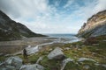 Hiking impressions at Bunes sand beach with view to Bunes Fjorden at Lofoten Islands in Norway on a blue sky with clouds