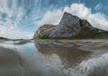 Hiking impressions at Bunes sand beach with view to Bunes Fjorden at Lofoten Islands in Norway on a blue sky with clouds